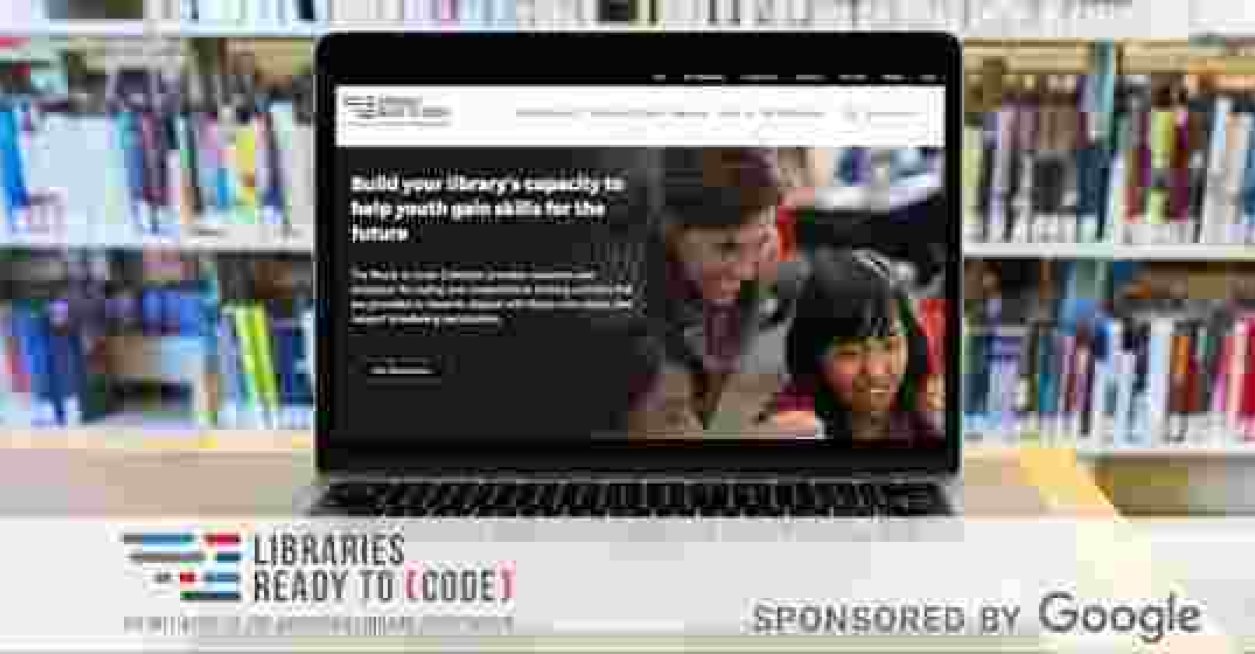 The ALA Ready to Code site on a computer screen with library books in the background
