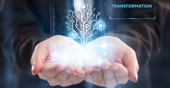 two cupped hands holding an image that conveys digital transformation