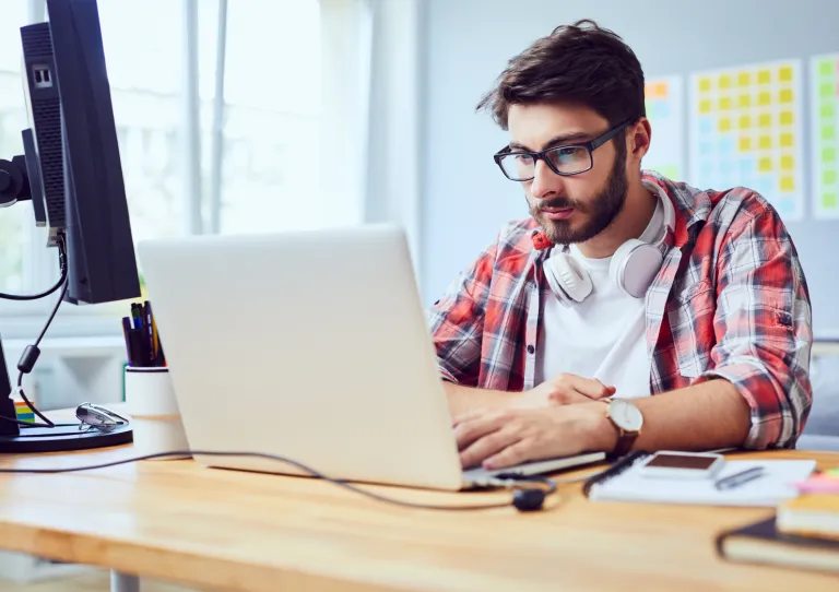 Person at laptop developing code